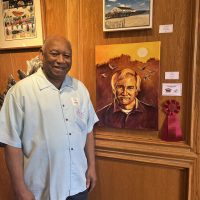 Honorable Mention award recipient James Melvin and his piece “Ray” (oil). Photo courtesy of Dare Arts.