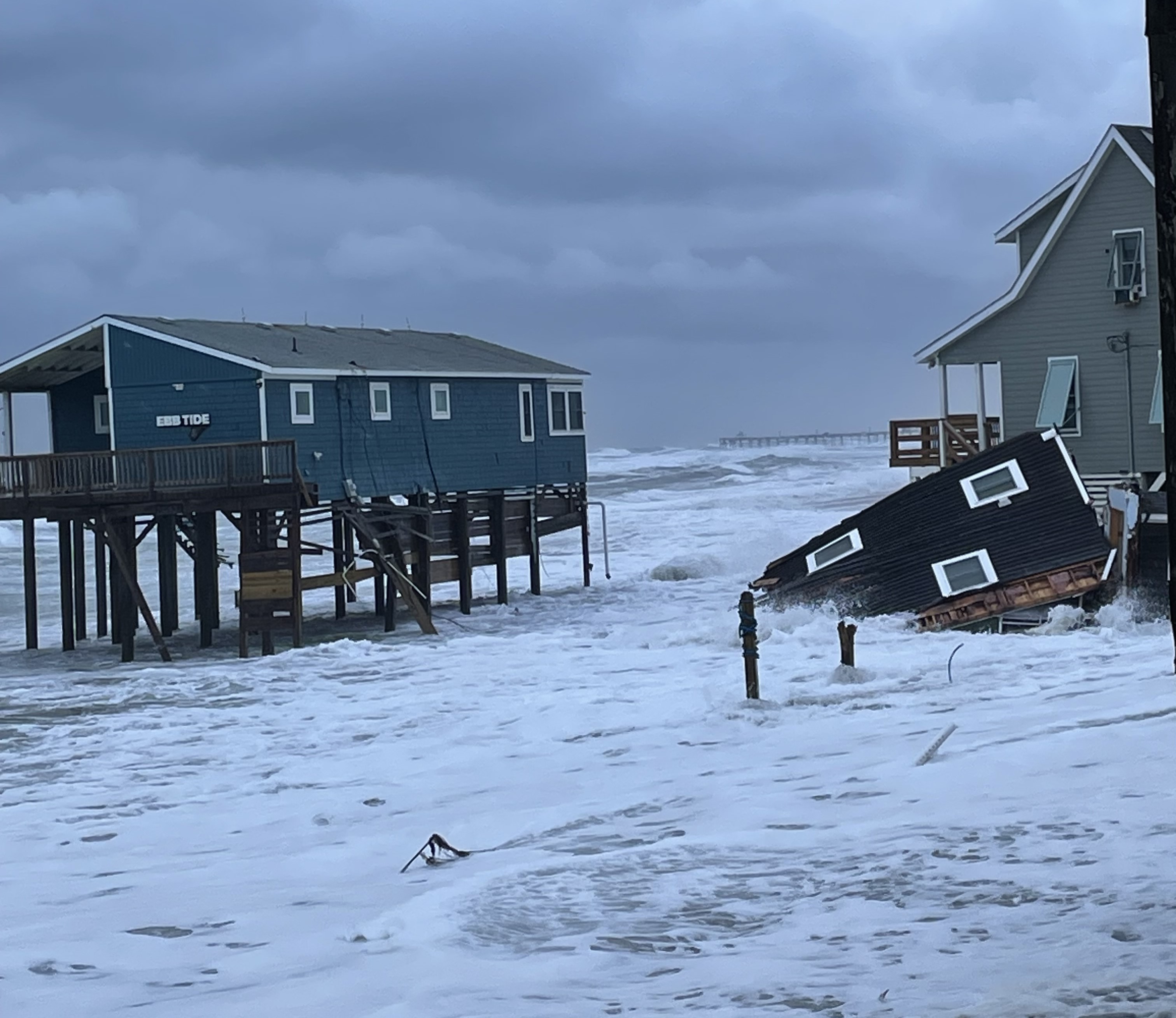 Photo showing portion of collapsed house at 23241 Surf Side Drive, Rodanthe